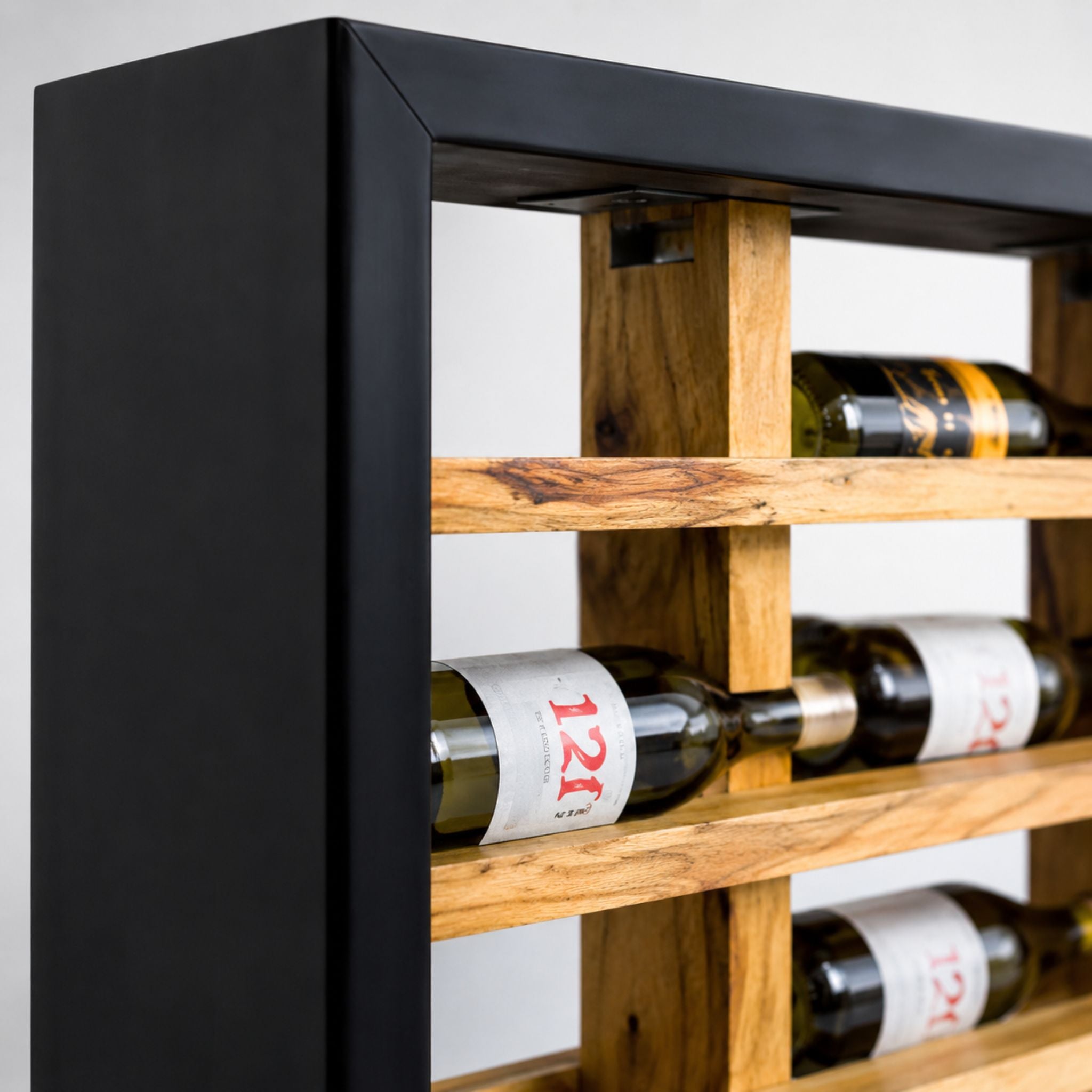 Close-up of natural wood rails and black frame detail on a handcrafted wall-mounted wine rack