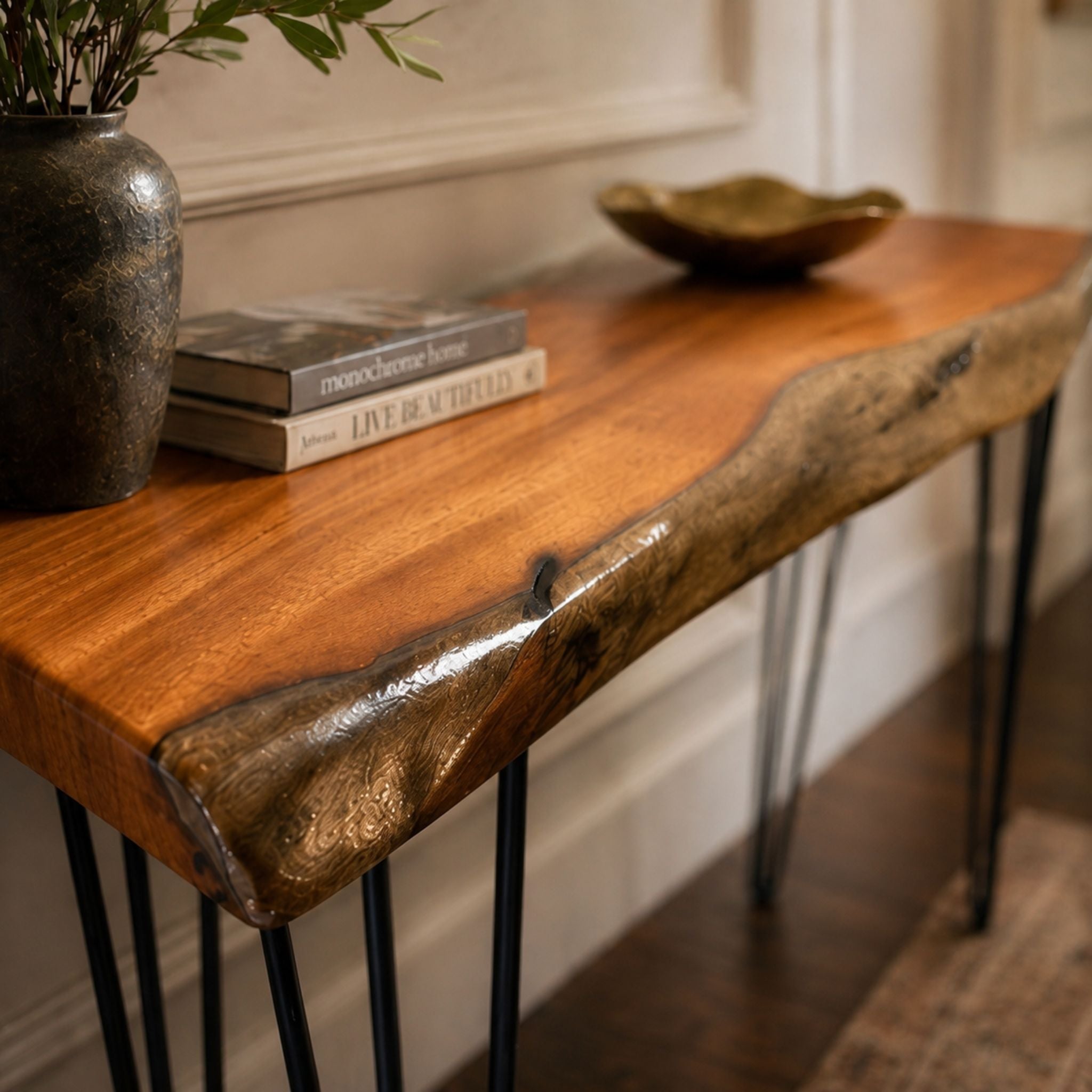 Close-up of natural live-edge wood grain and organic character detail on a handcrafted console table
